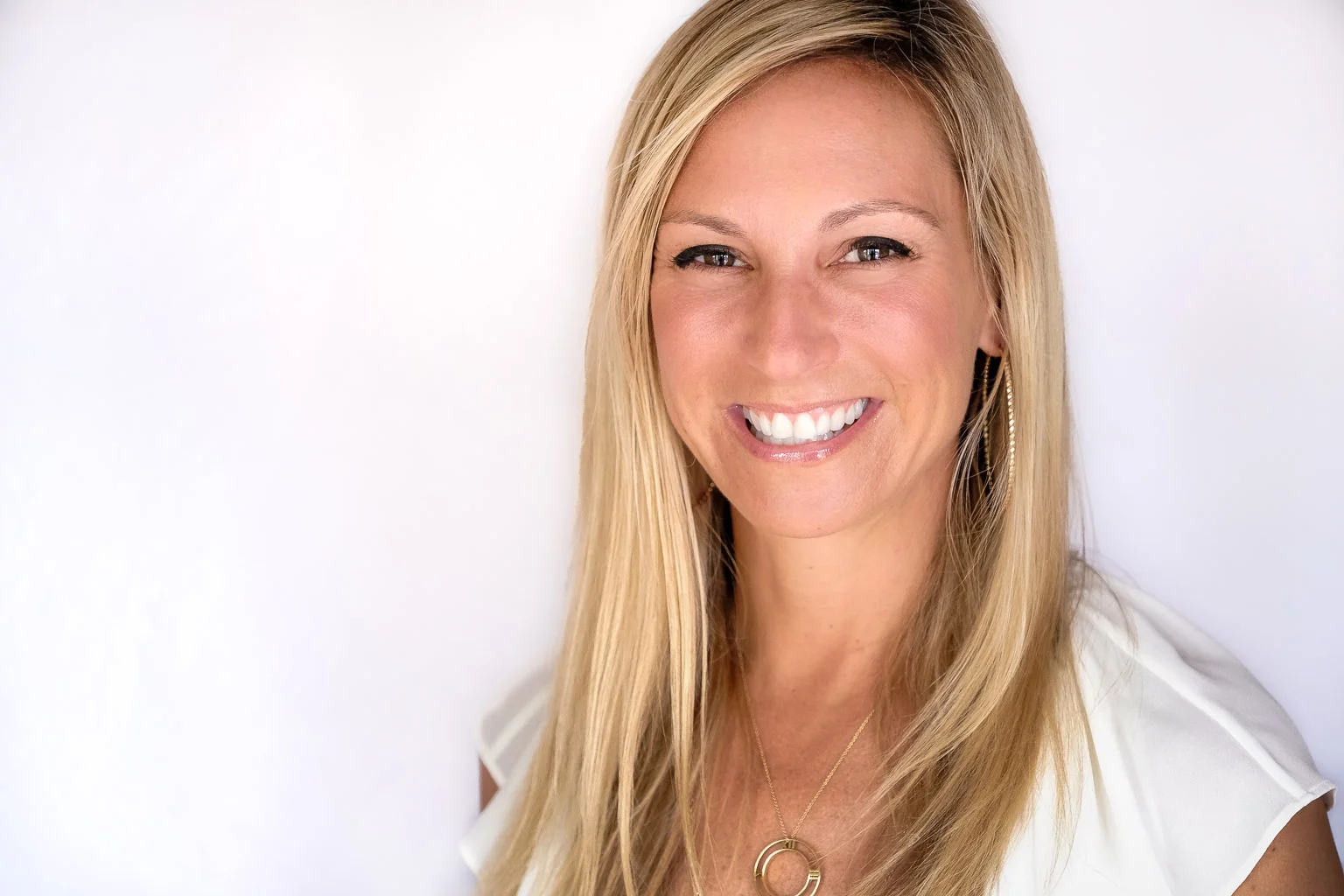Mom got her headshot standing in her living room. I didn't have to coax this smile out. There are some little people standing behind the backdrop doing some serious clowning!