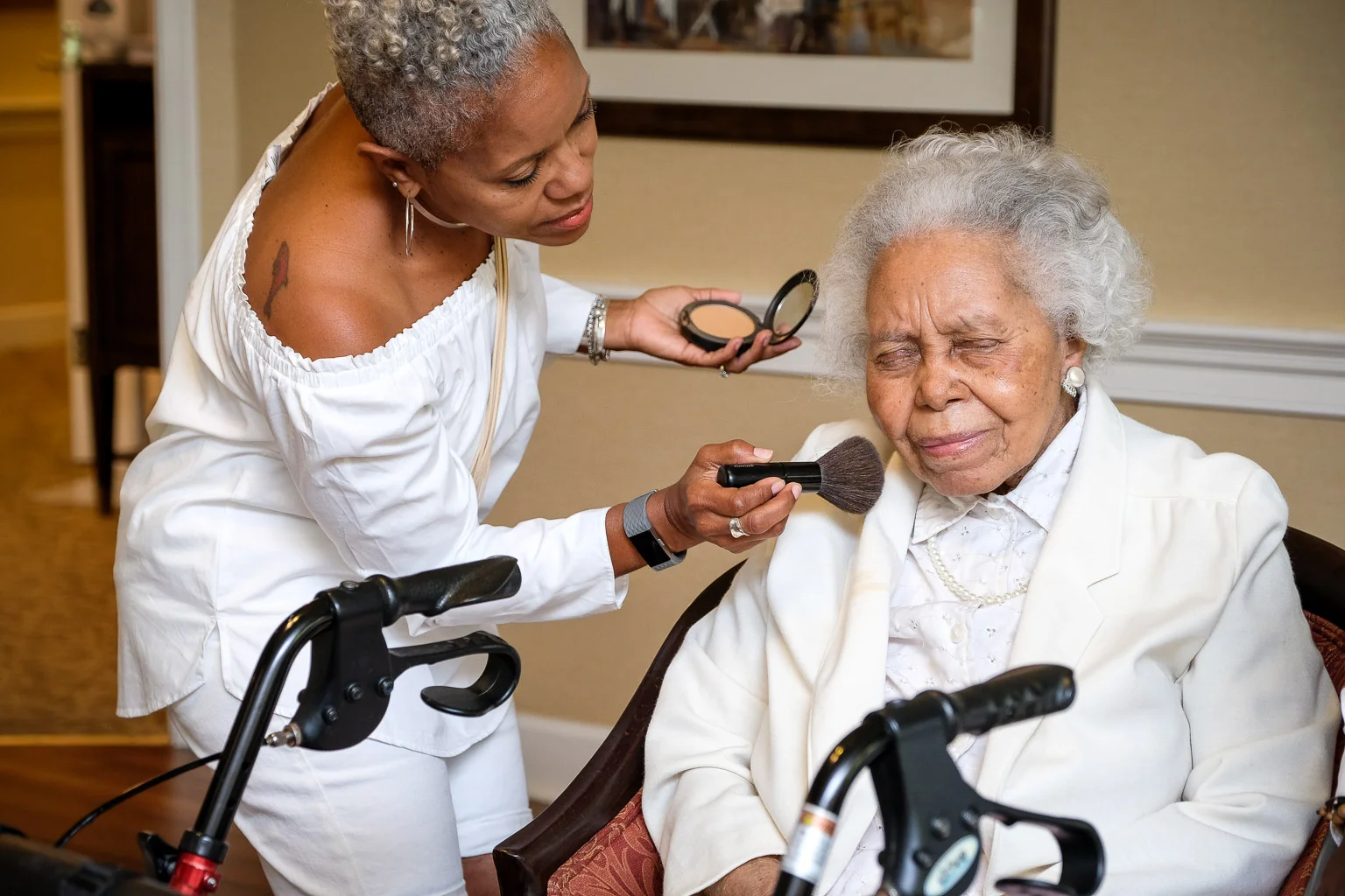 The grand matriarch being attended to by her clone.