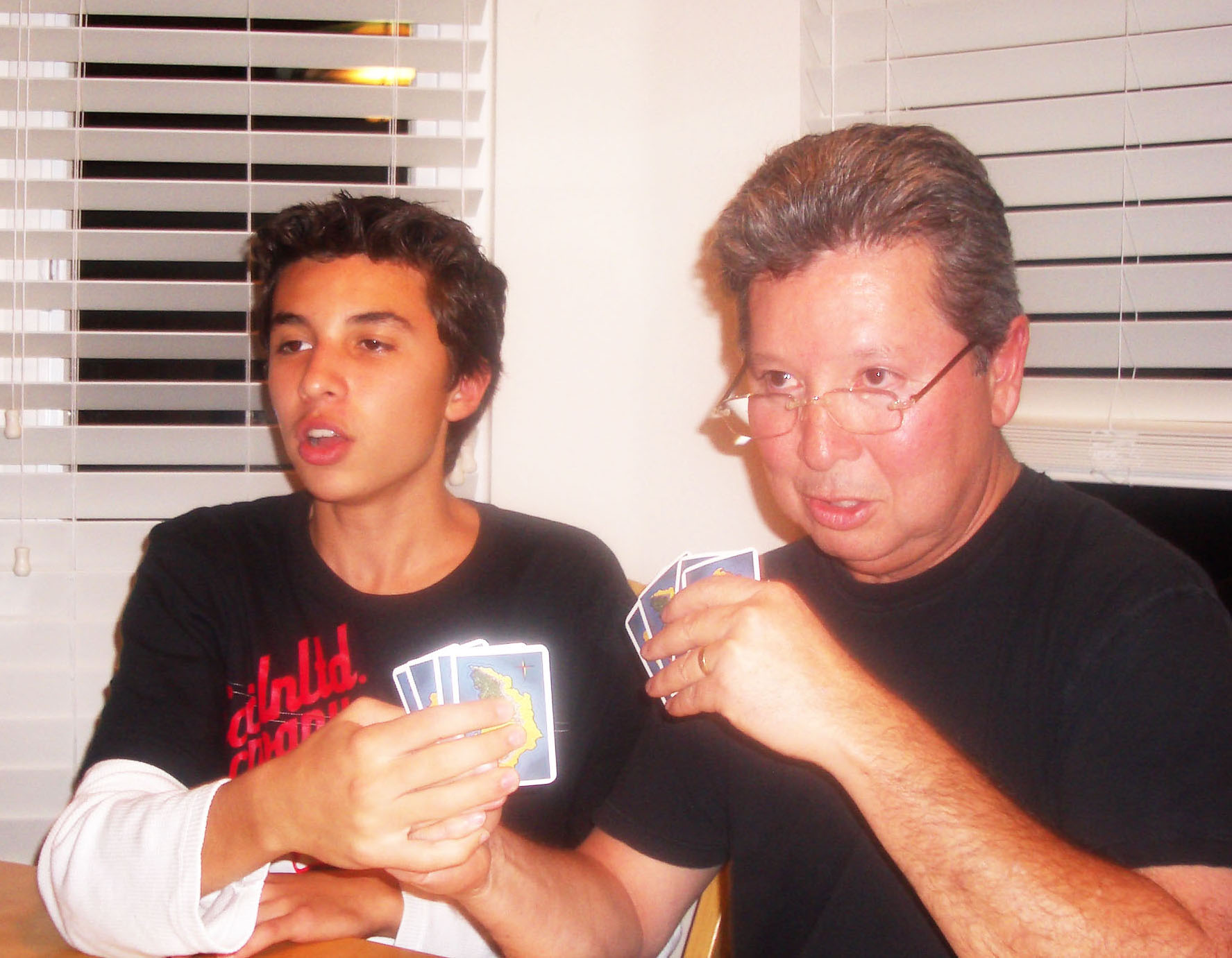 Daniel and dad playing cards cropped.jpg