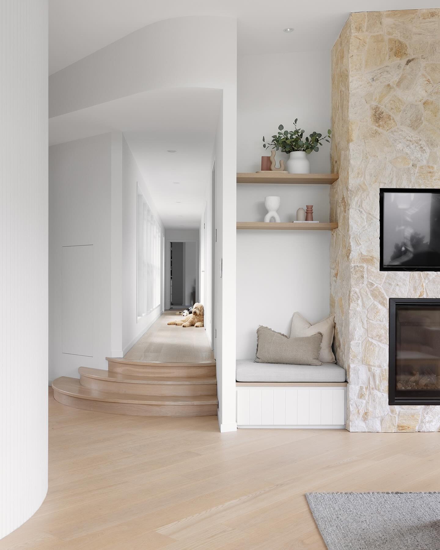 Another glimpse inside our Currumbin Valley project&hellip;.if you look up the hallway you will see my best friends dog Ruby chilling out. Curved stairs, curved walls, oak floors and a stone fireplace 😍