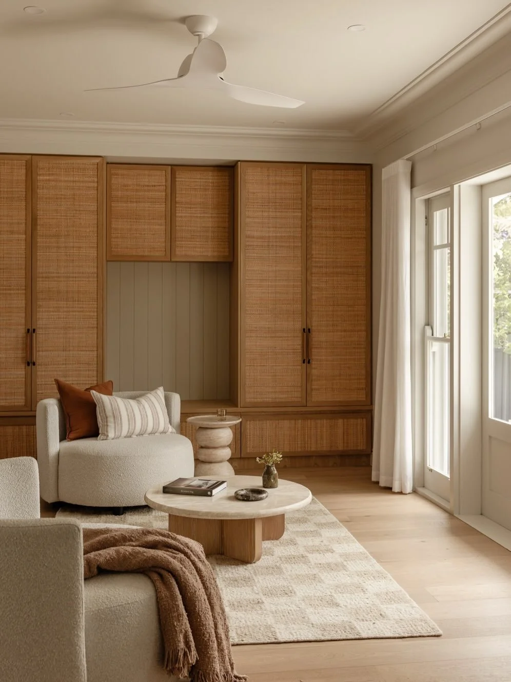 Rounding out the Loftus project by sharing a few shots of the living spaces. A huge stone wall in the living area for maximum warmth and texture, a full wall of joinery featuring a shaker detail with rattan inlay for even more texture and then a beau