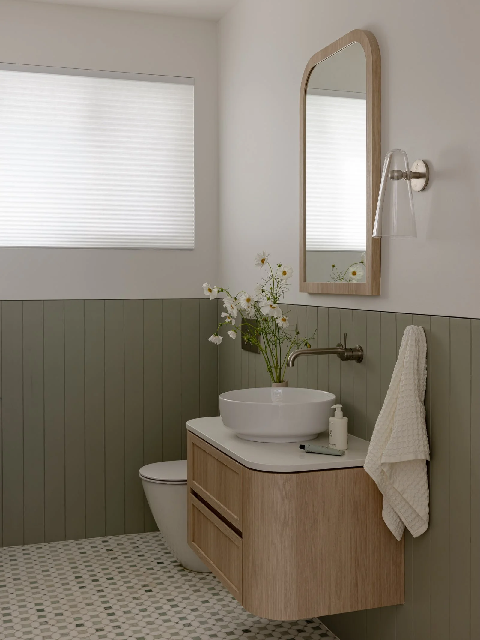The wet areas in our Wombarra project were a mix of classic coastal downstairs and minimal and clean upstairs, but colour was the common element that ran through each of the spaces helping them tie together! An entirely green and blue bathroom with a