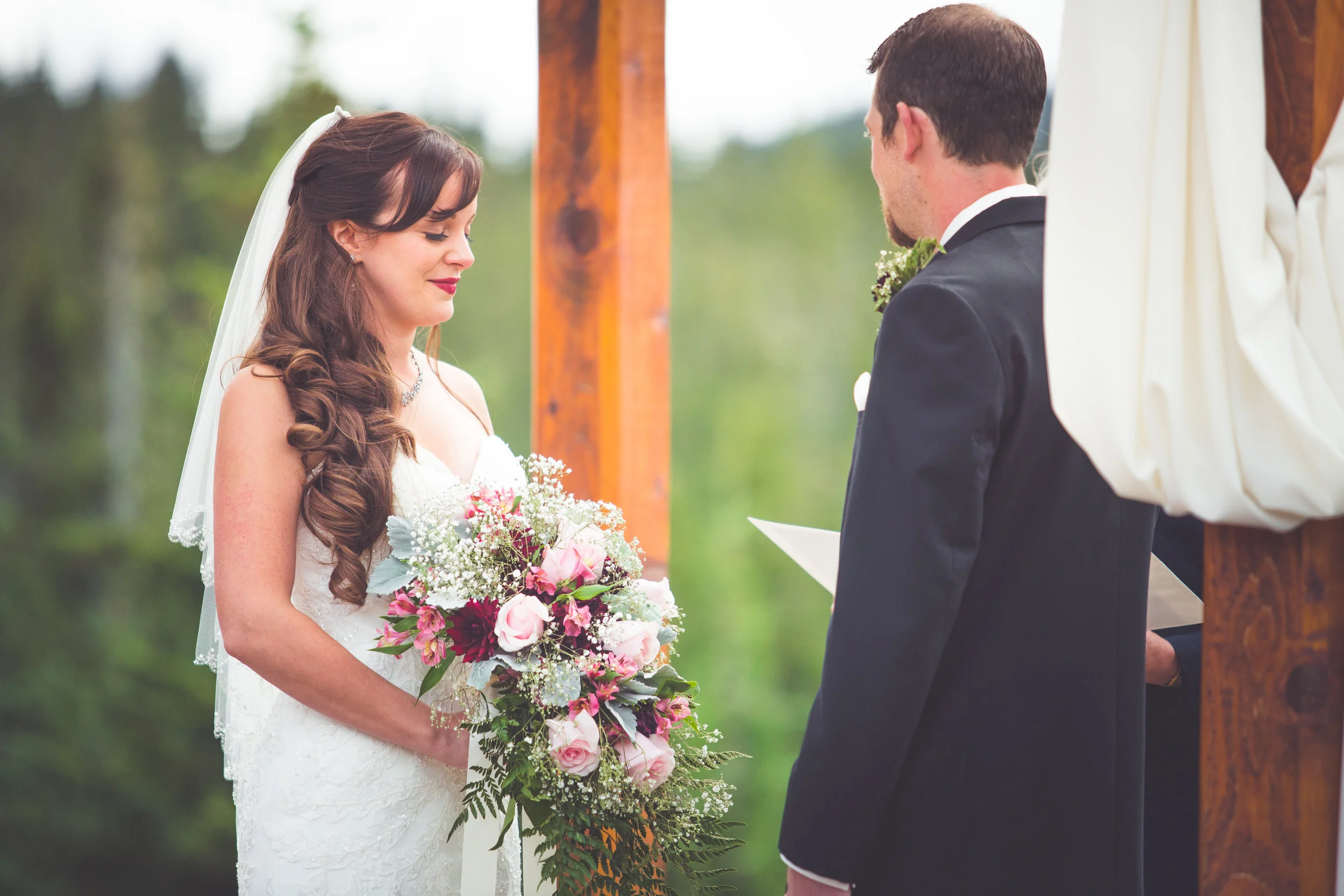 bride closes eyes during prayer at mount washington wedding