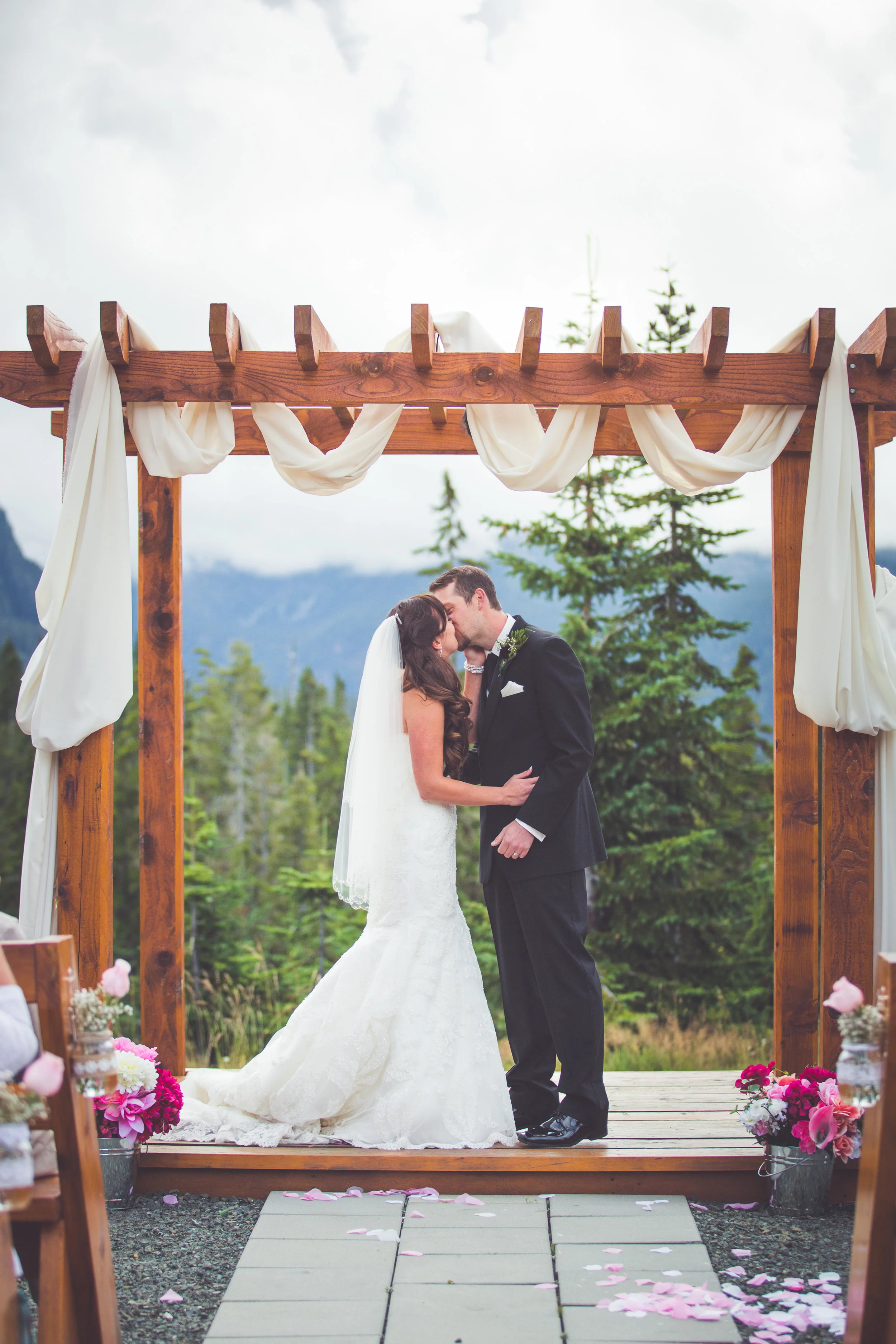 bride and groom kiss at mount washington resort wedding
