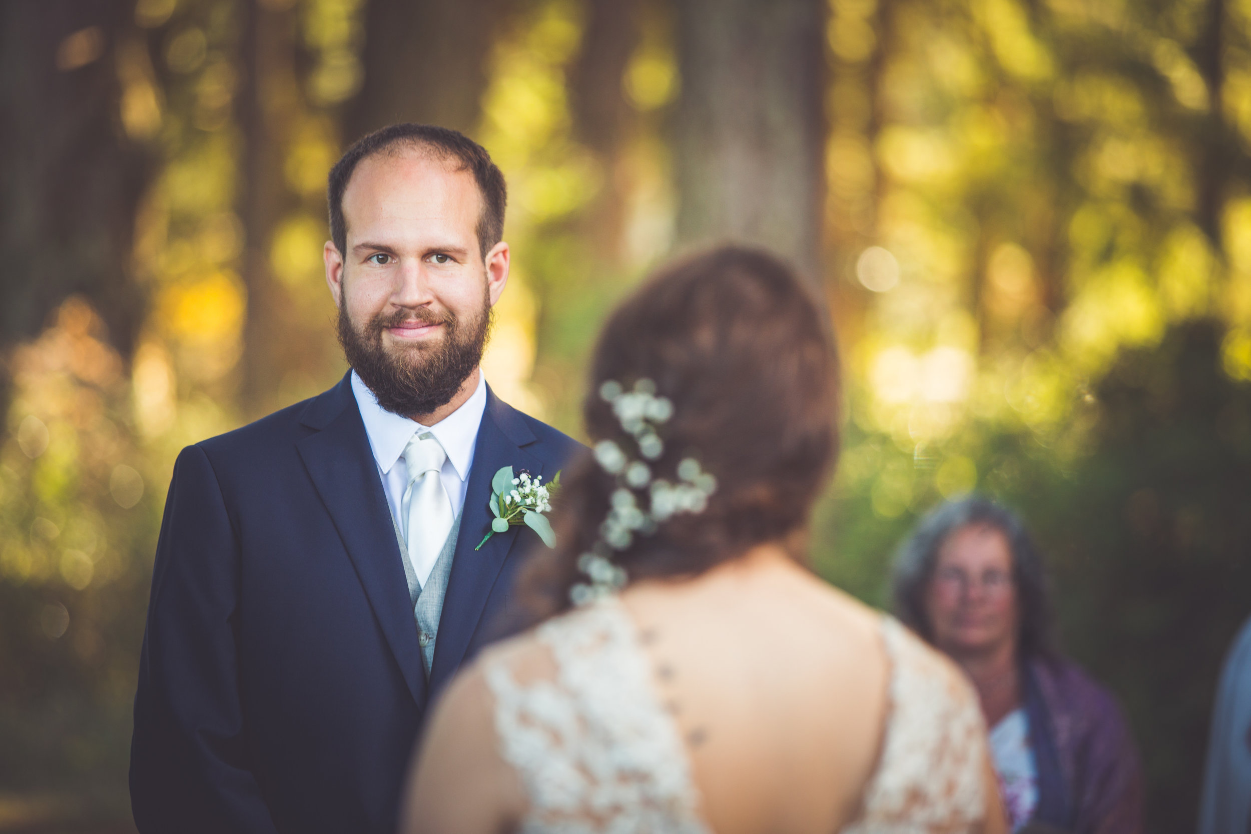 groom looks at bride during parksville bc wedding vows