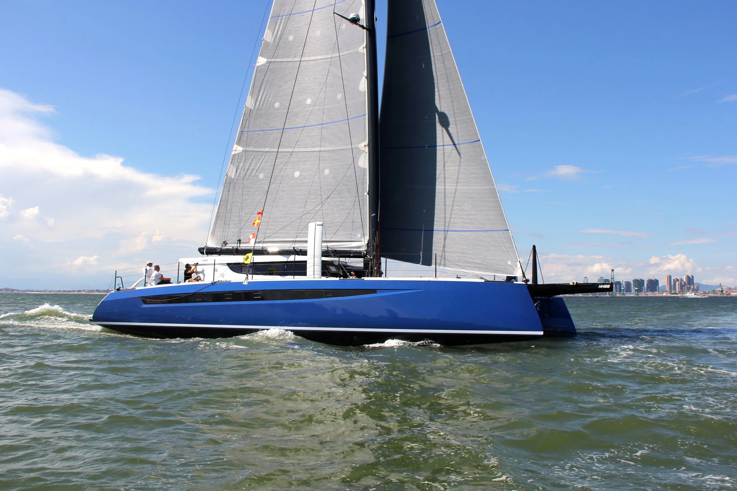 HH66-05 FLASH launched last week in Xiamen, upping HH Catamaran's on-water fleet count to five. The gorgeous Morrelli & Melvin design is the first of the forward helm HH66s and sports electric blue hulls, a slick flush bimini, and bonus bucket seats and tillers aft. This dual purpose configuration allows owner and crew to choose helm position in any given condition or circumstance. Push button mainsheet, traveller and self-tacking jib sheet controls integrated into the ORMA-style bucket seats give the helmsman complete control. FLASH will complete sea trials in Xiamen before being shipped stateside later in the Summer, and will make her world debut at the United States Sailboat Show in Annapolis in October. Have you been waiting to get aboard and see this one-of-a-kind cat? Drop us a line at sales@hhcatamarans.com to schedule an appointment and avoid the lines. 