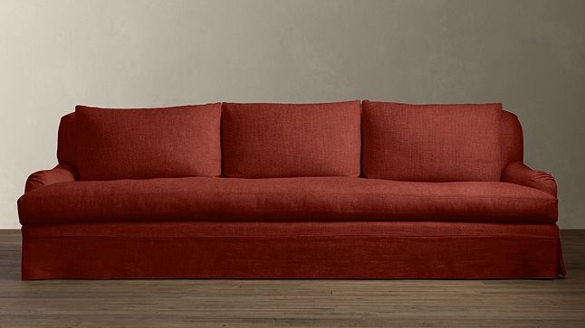 1. Let's focus on the living room, and let's pretend you have a rectangular living room that is 20' x 15' with large windows and a kick ass fireplace (similar to our client). We will start by mirroring two 6 foot long rolled armed sofas in a bold color. You can find something similar to what we use here . 