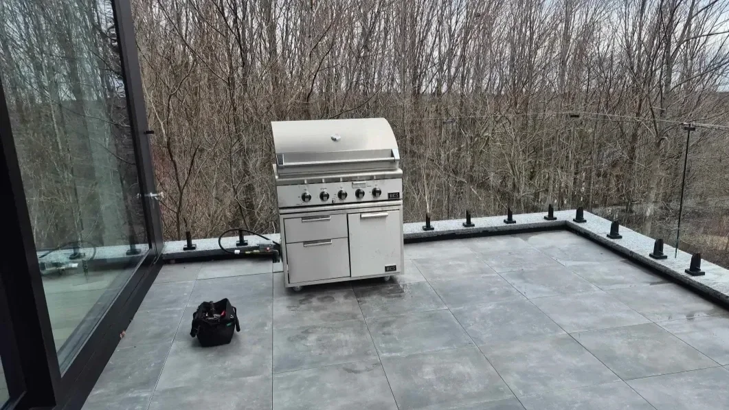 Natural gas BBQ hooked up on a stone patio in Toronto by Barbeque Pro