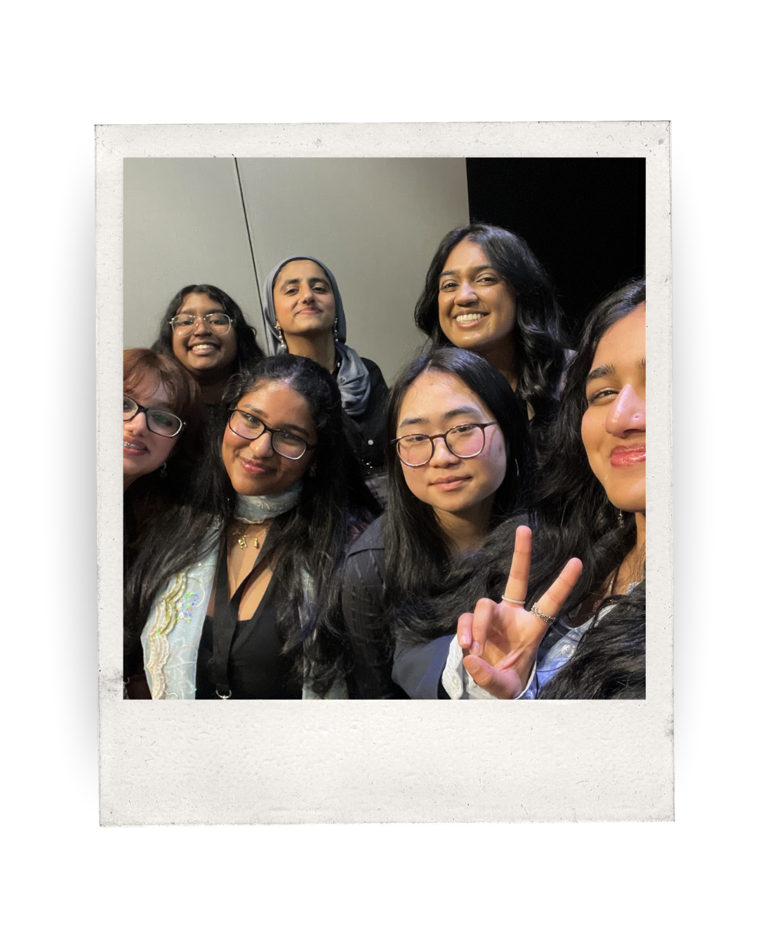 a group of young people pose for a selfie