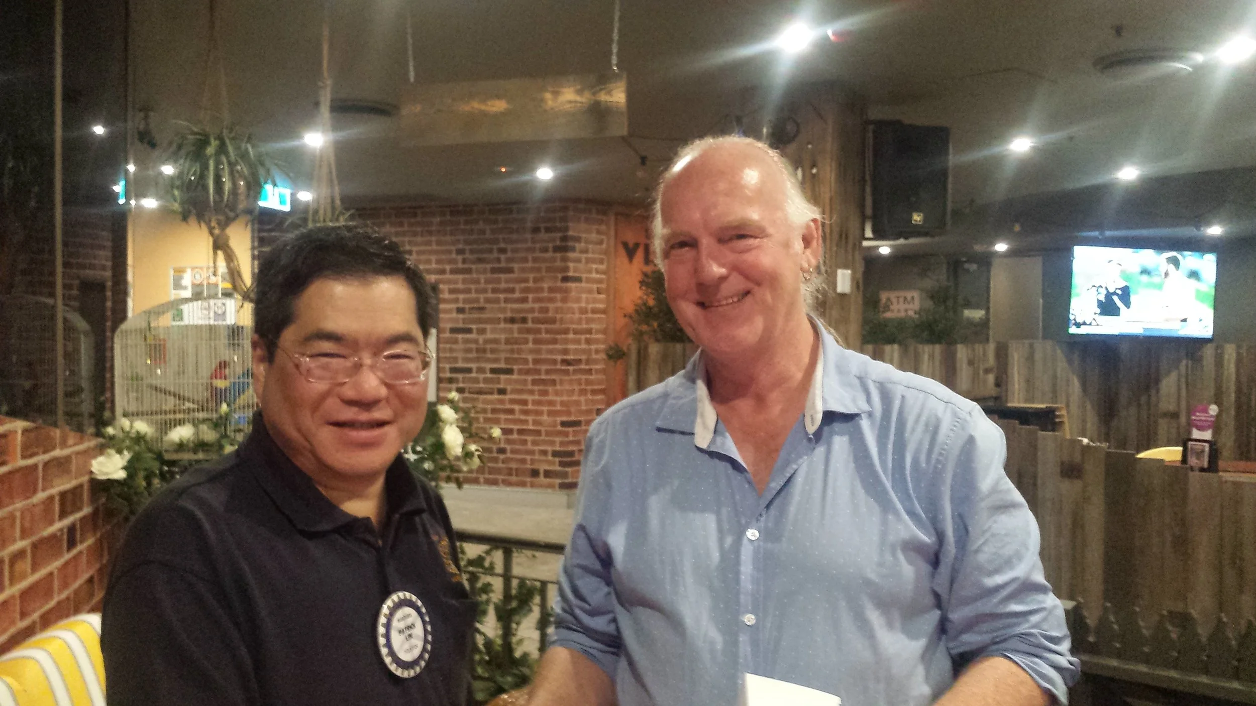 Laurie Matthews with Patrick Lim, President of the Maroubra Rotary Club.
