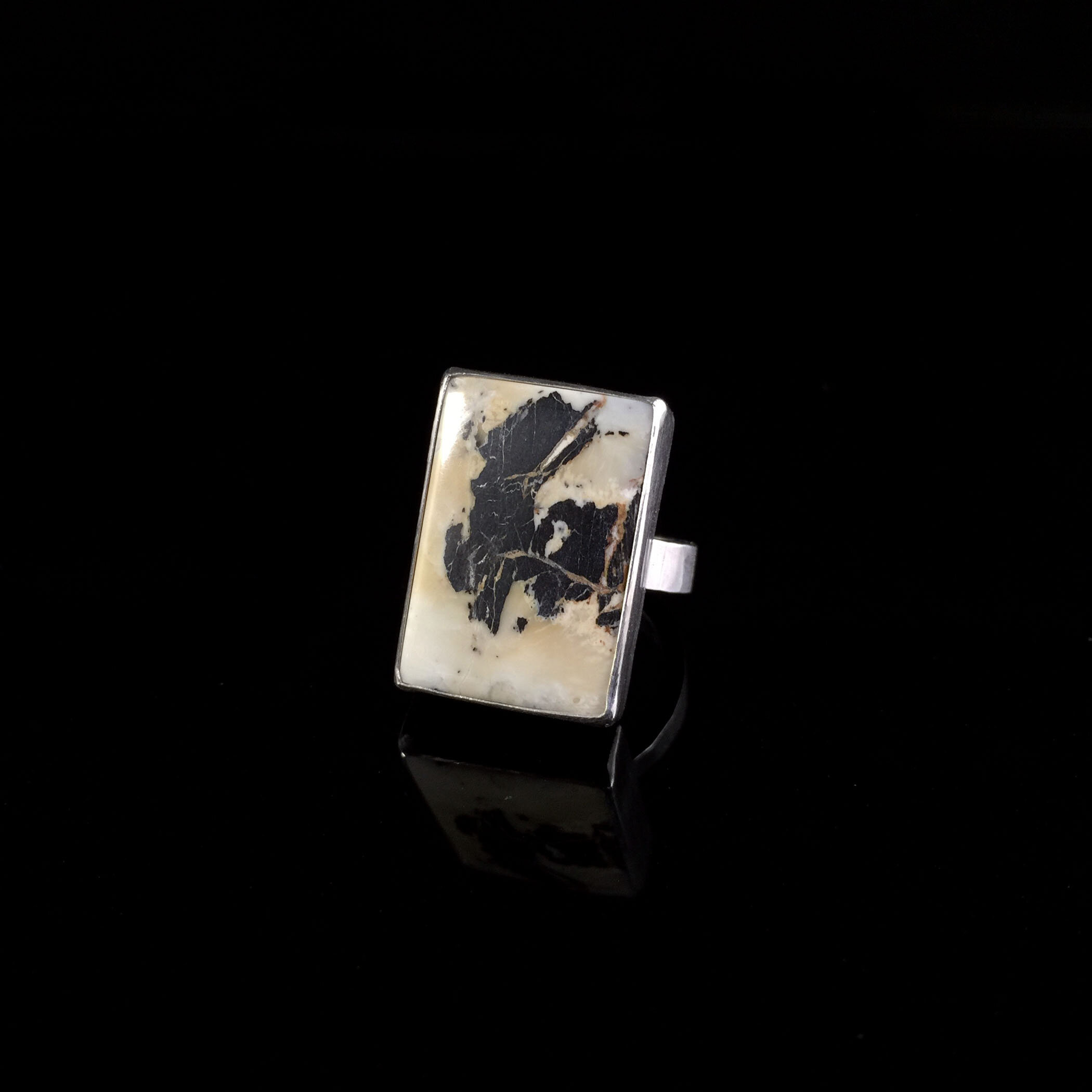 rectangular bezel set white buffalo turquoise ring in sterling silver 3:4 view.jpg