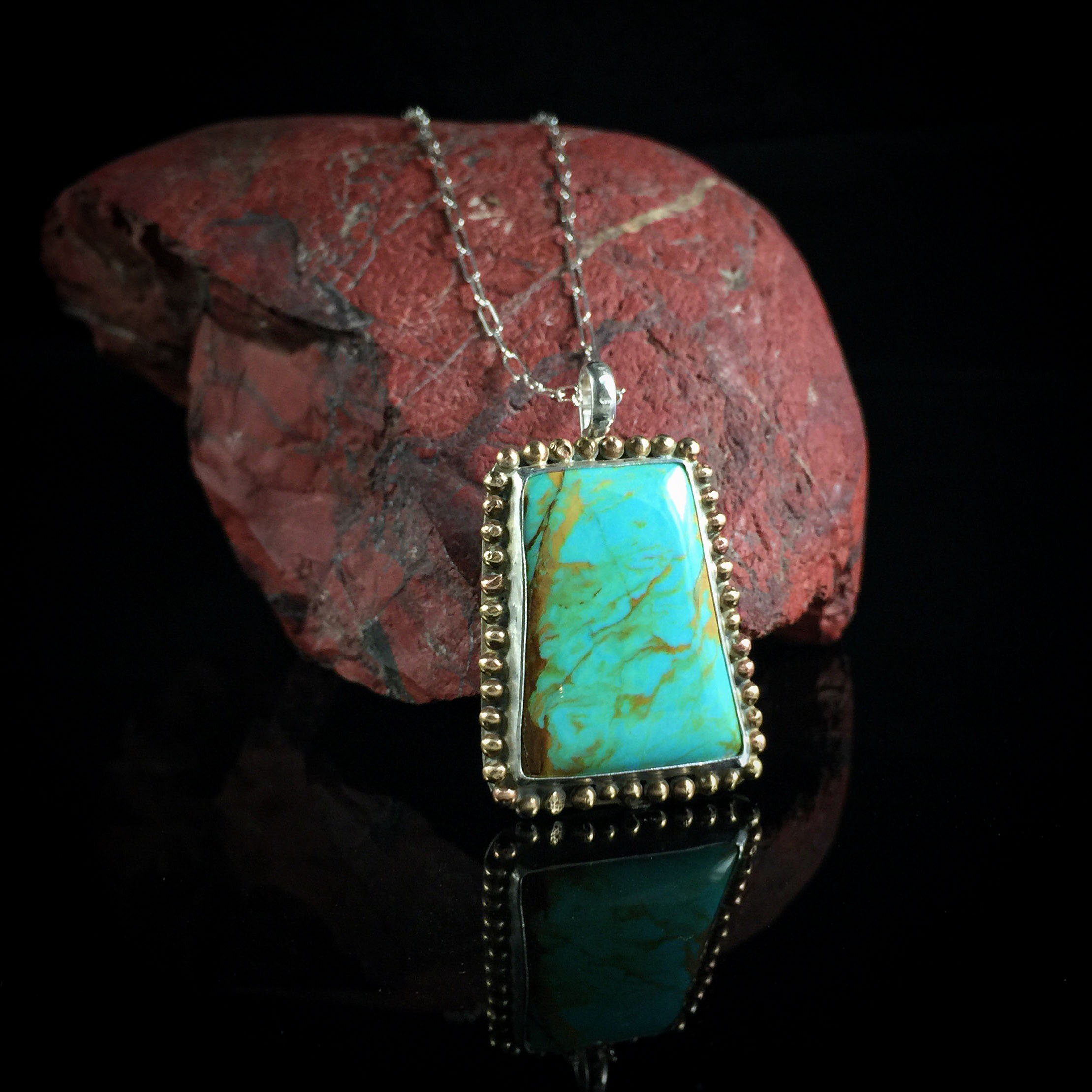 Kingman turquoise magdalene set in sterling & brass SPM.jpg