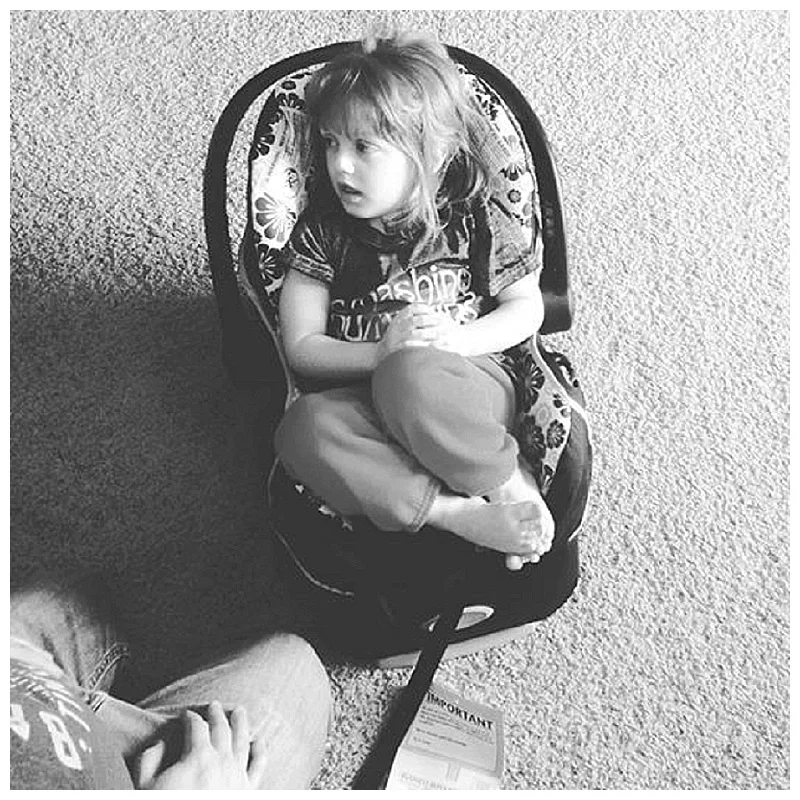 Molly give Baby #3's new seat a test run (She's 5, people. FIVE....and she nearly fits snugly in an infant seat. MY.KID.IS.WEE.