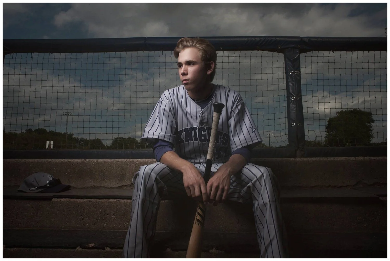 This picture was taken in a dug out (I believe this was Snappers Field). Dug outs can be found in most public baseball diamonds or softball places as well.