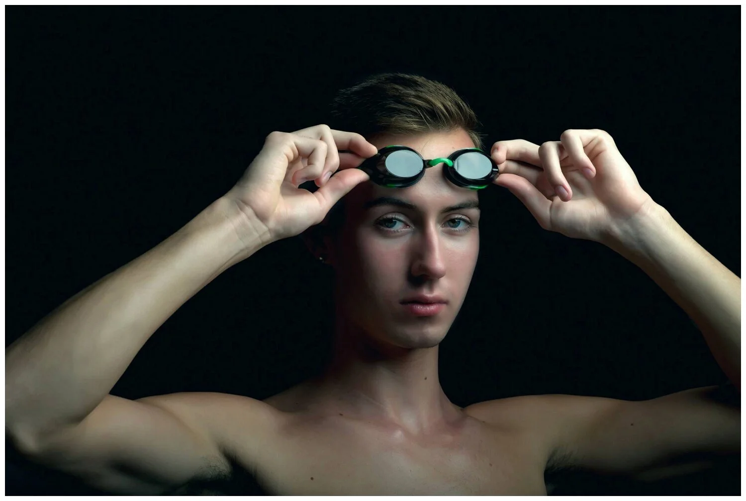 This portrait was taken in a BRIGHT swimming pool area. With lots of natural light. How, you ask? Crafty lighting.
