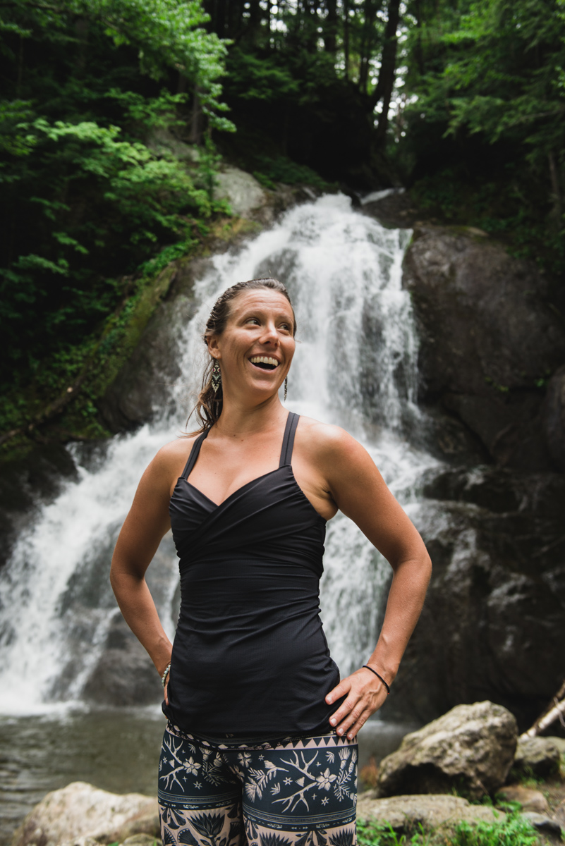 Girl in front of waterfall