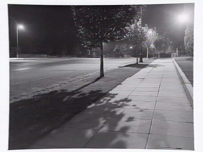 When darkness falls, more and more young people have nowhere to go. Suburban street, Box Hill, at night, Lyle Fowler (1949). Photo courtesy of the State Library of Victoria . 