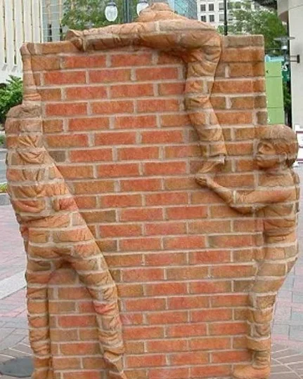 Conditional welfare creates barriers to recovery for single mothers and their children. Sculpture by Brad Spencer , "Life is an Open Book," Charlotte, NC. 
