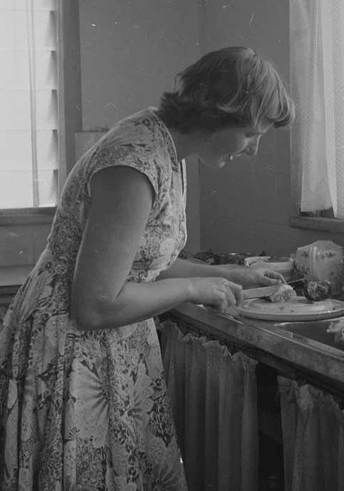 Some things haven't changed. Australian women spend far more time on food preparation than men. Photo credit Marc Strizic (1928-2012) . Sydney woman preparing a meal, 1954. Courtesy State Library of Victoria.
