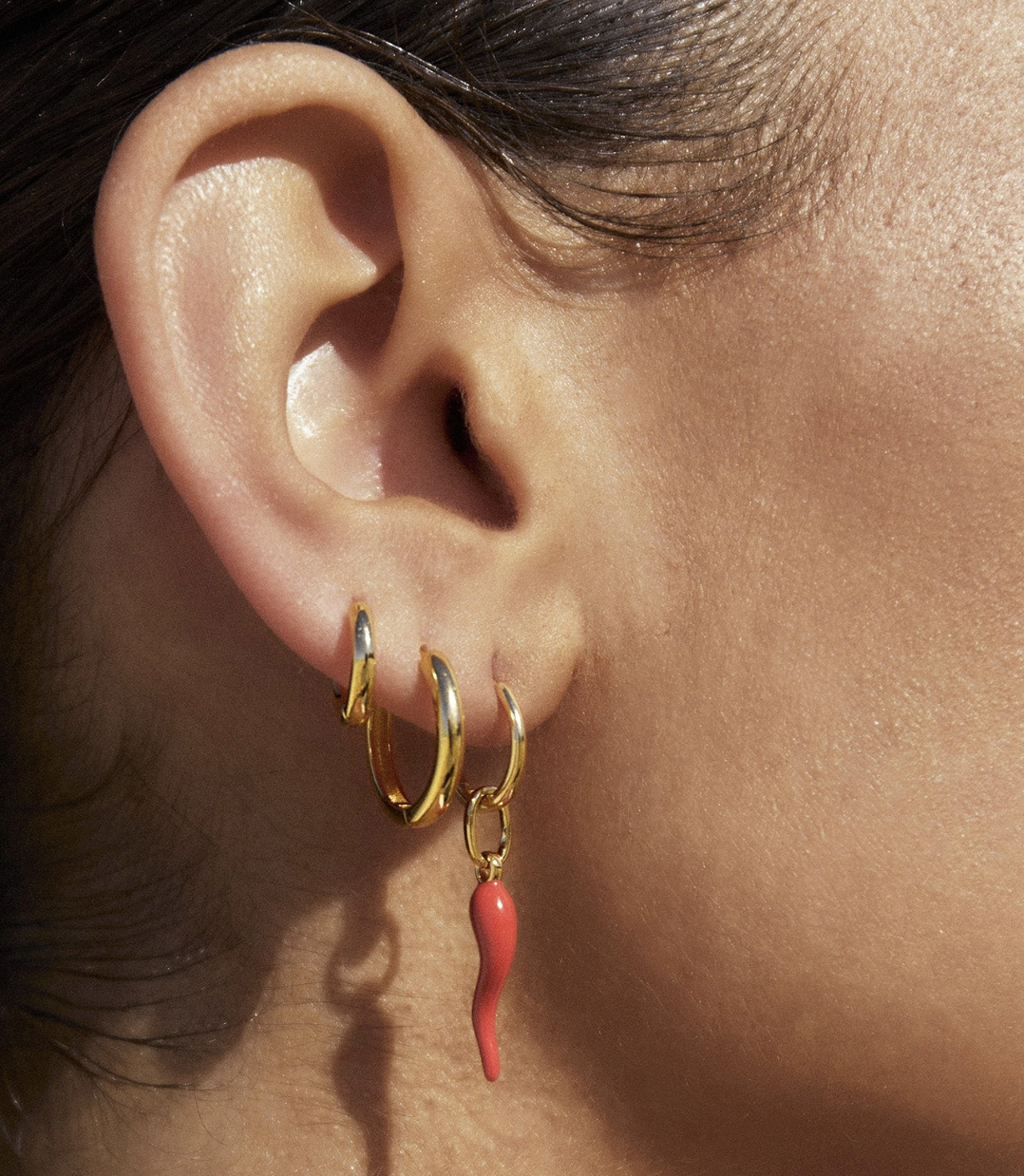 Made for stacking and playful style, The Cornicello Red Charm Earrings are here to add some colour and spice to your everyday stack!