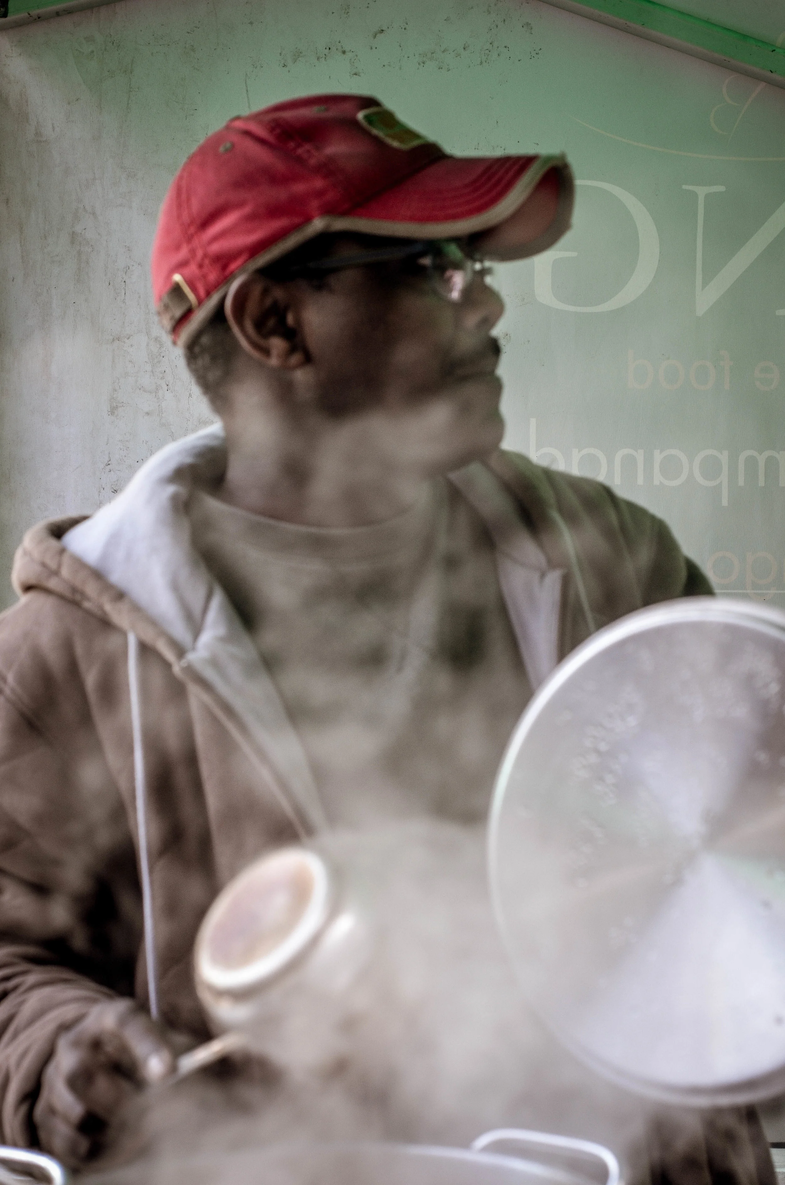 Anwar from Sudan brewing up some chai at the markets.