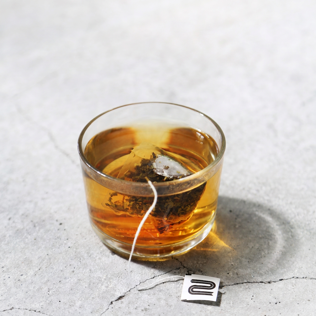 A NEMI Teas bag in a cup