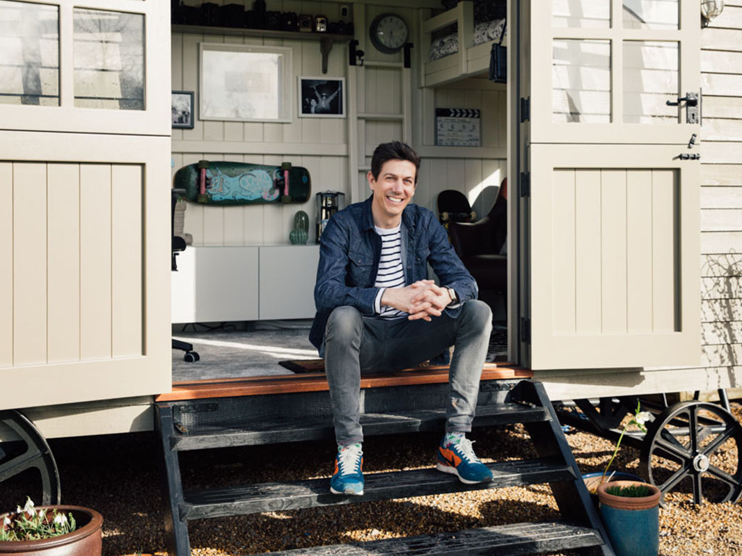 Dan in his shepherds hut home office