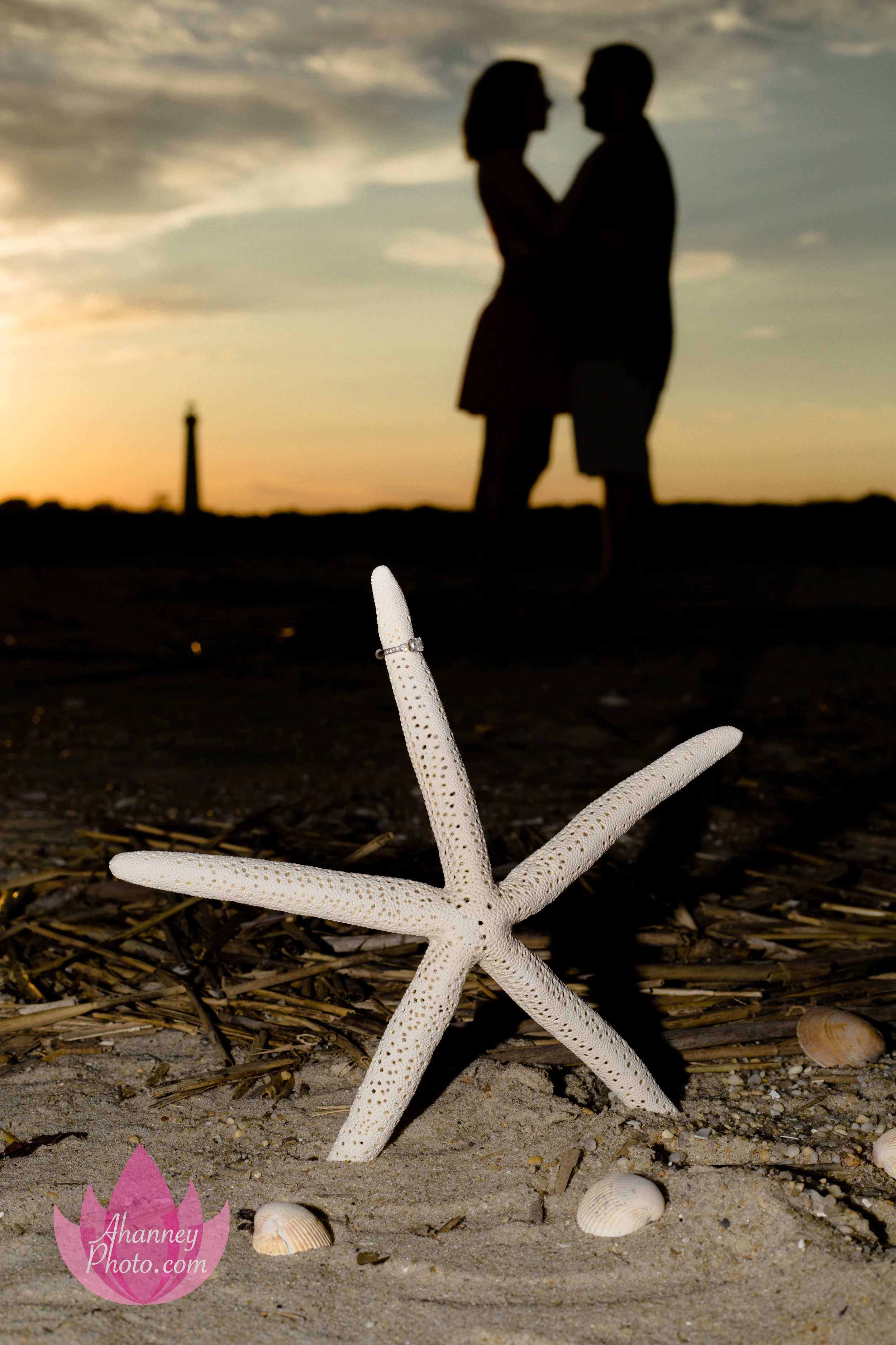 Engagement Photography Ring on Starfish Beach Silhouette at Cape May New Jersey Shore with Lighthouse during Sunset AHanneyPhoto