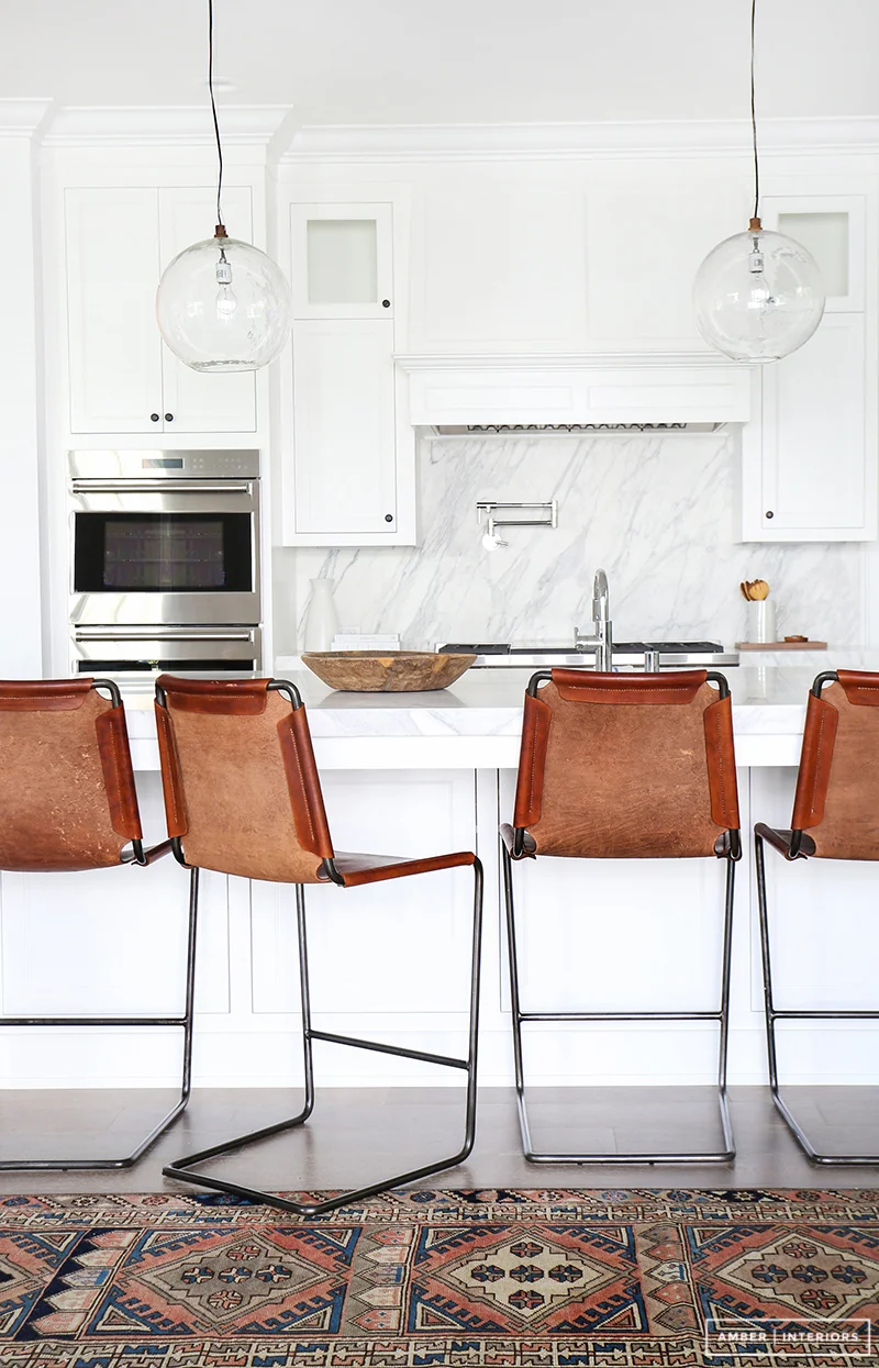 A contemporary kitchen with indie style. LOVING this eclectic look. Design by: Amber Interiors, Photo by: Tessa Neustadt