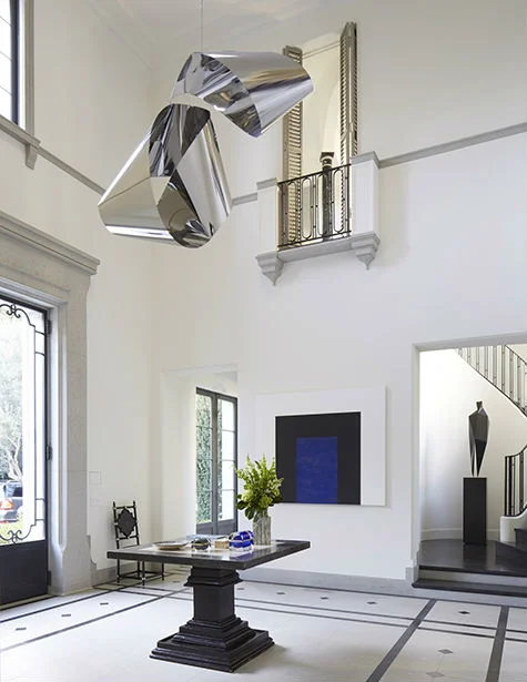 {Hanging stainless steel sculpture, Mark di Suvero; Painting, Mary Corse}
