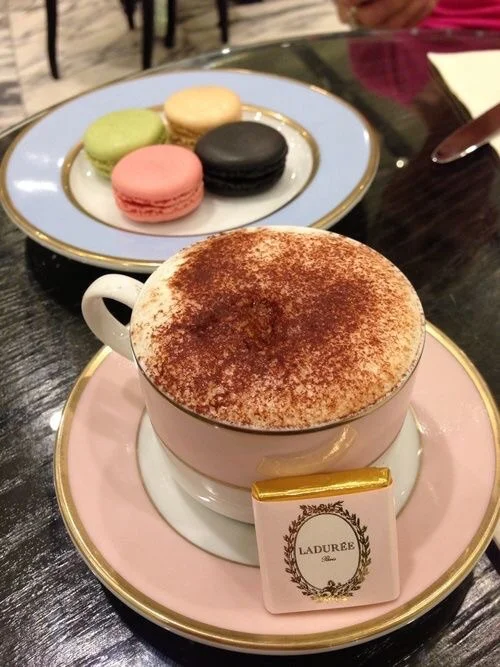 Macaroons and a café au lait. {Image Source: Foursquare}