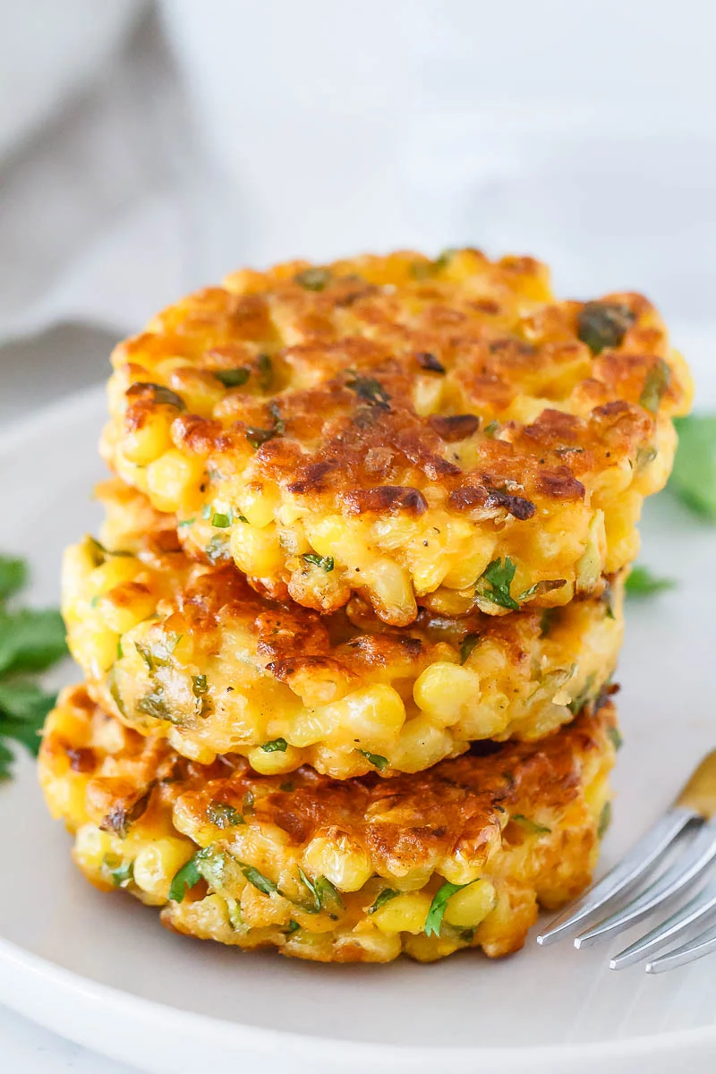 Cheesy Corn Fritters via House of Yumm .