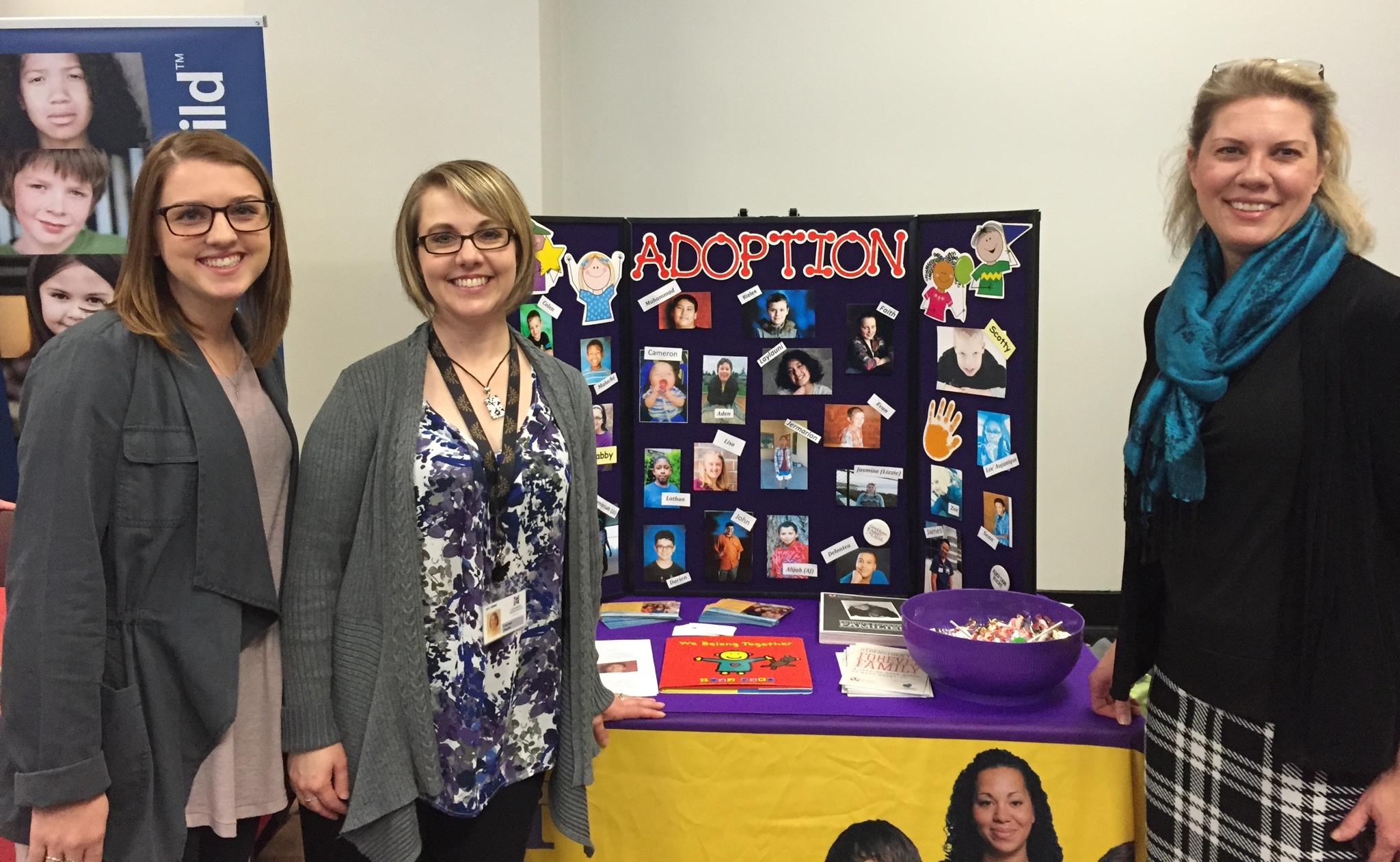 Courtney Davis, Wendy's Wonderful Kids intern; Courtney Angeles, program supervisor for Adoption; and Libby Hein, chief program officer, celebrate National Adoption Day at the King County Courthouse in Seattle.
