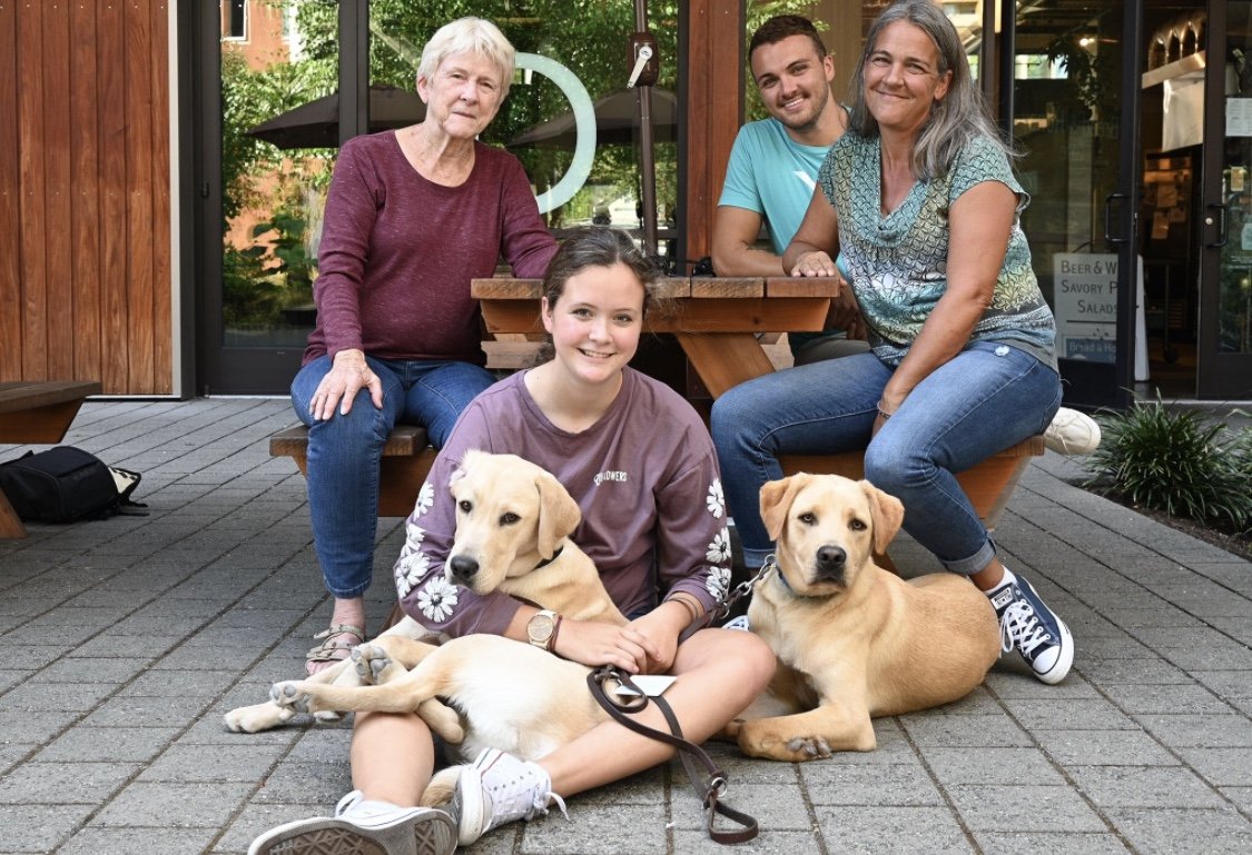 Kris family with guide dogs.jpeg