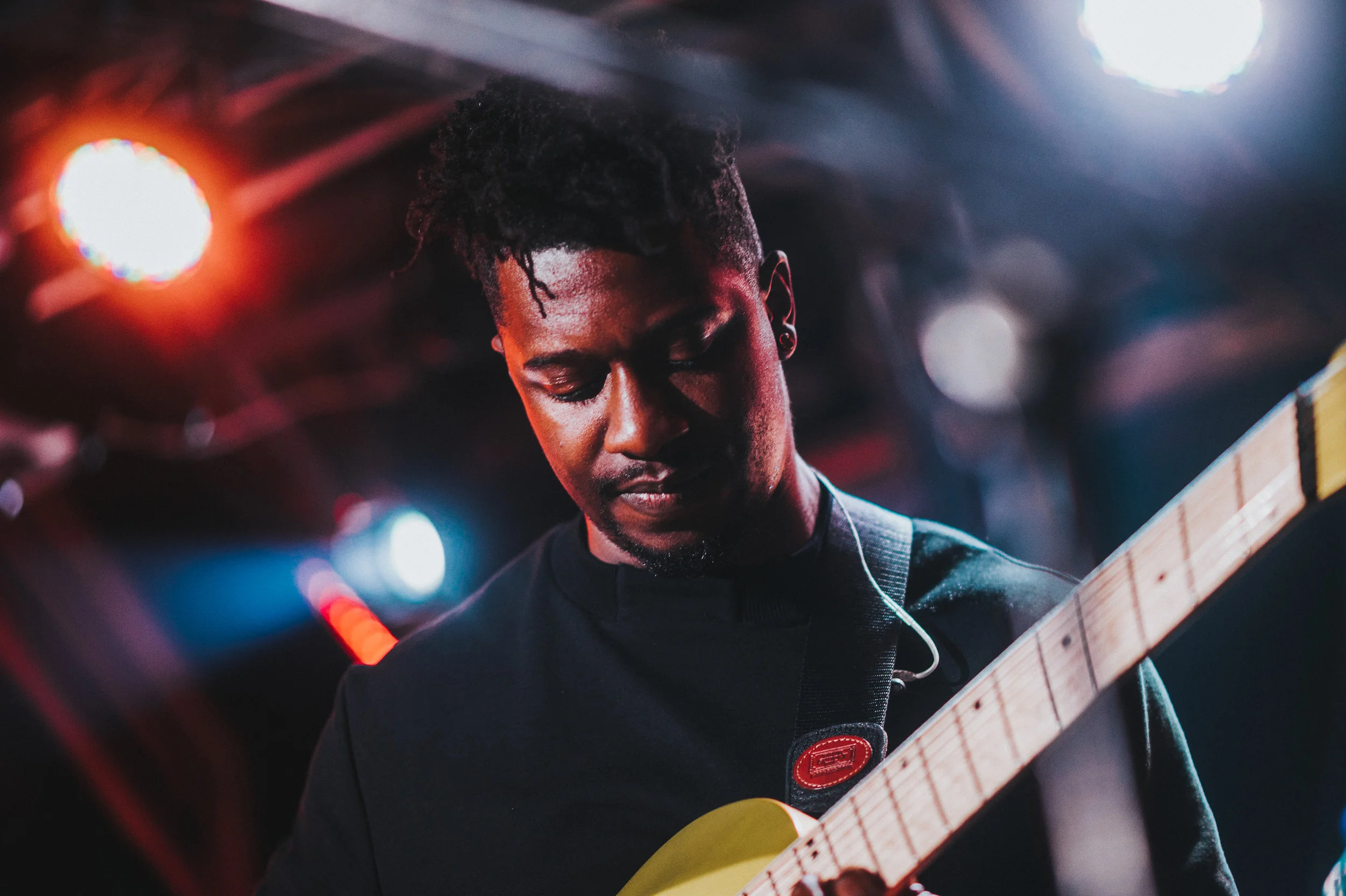Tosin playing guitar from Animals As Leaders