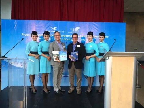 Dean Jones of Realogics Sotheby's and John Spear of Tiger Oak Media with Xiamen Airlines. Seattle-Tacoma International Airport. 