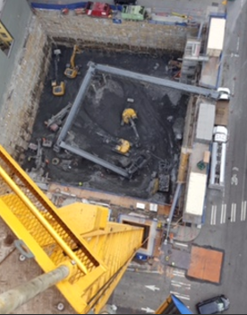 Above: A SKANSKA worker snaps a cell phone picture from atop the crane tower at NEXUS – the only high-rise condominium currently being built in downtown Seattle. 