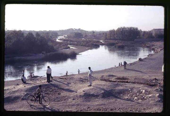 0265 People Standing Along Riverbank.jpg