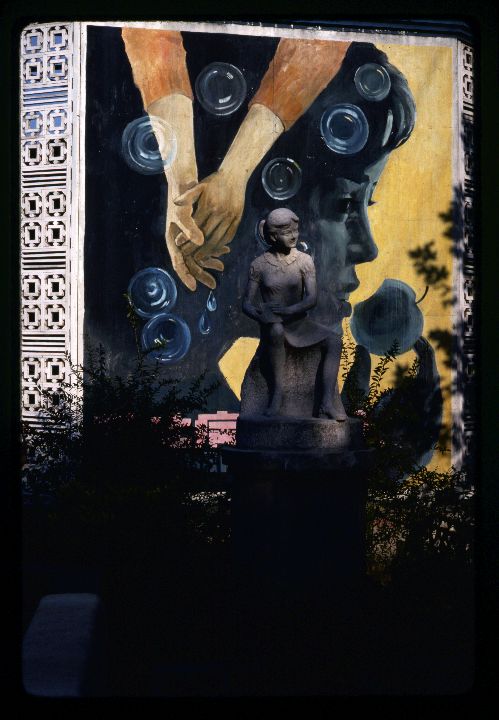 0541 Statue of Girl Sitting-Mural Behind.jpg