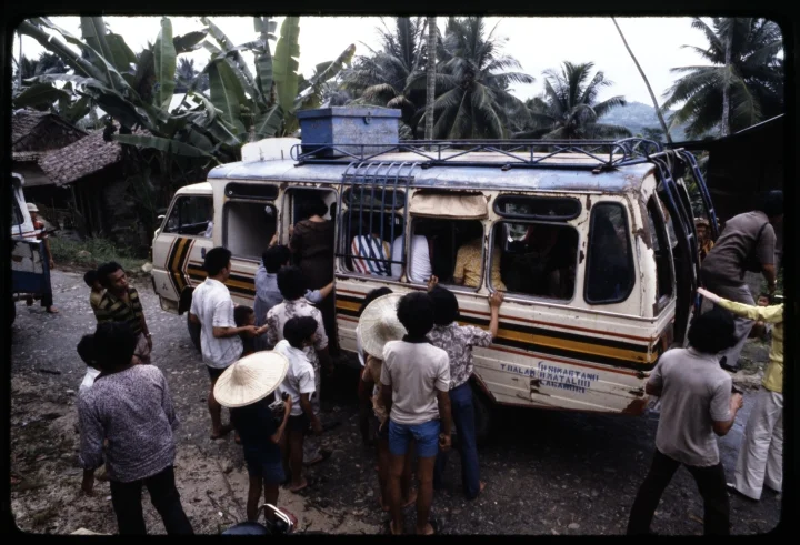 0784 People Cramming onto Small Bus.jpg
