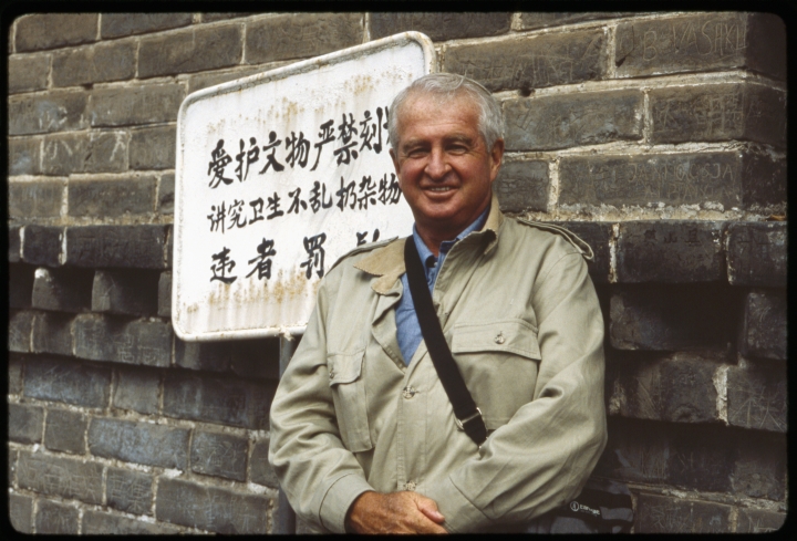 1200 Man Standing in Front of Sign.jpg