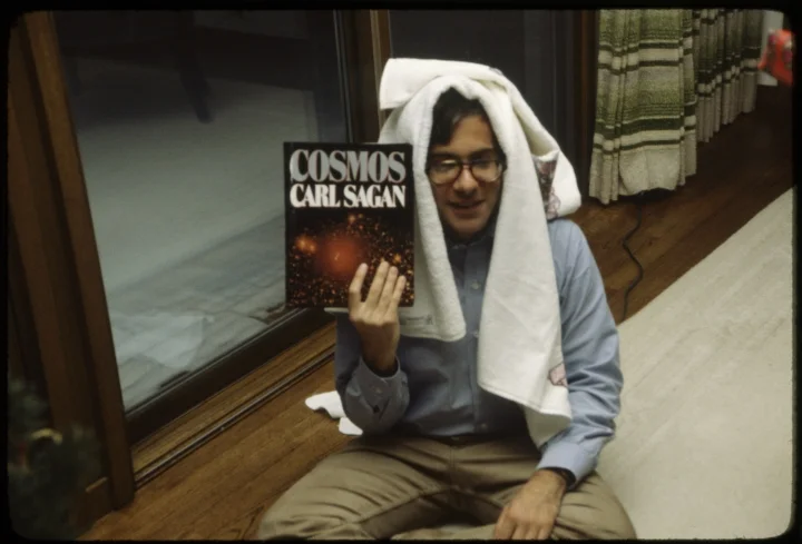 1581 Man Holding Cosmos.jpg