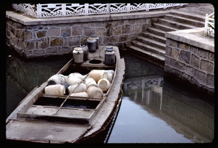 0631 Boat with Jugs at Dock.jpg