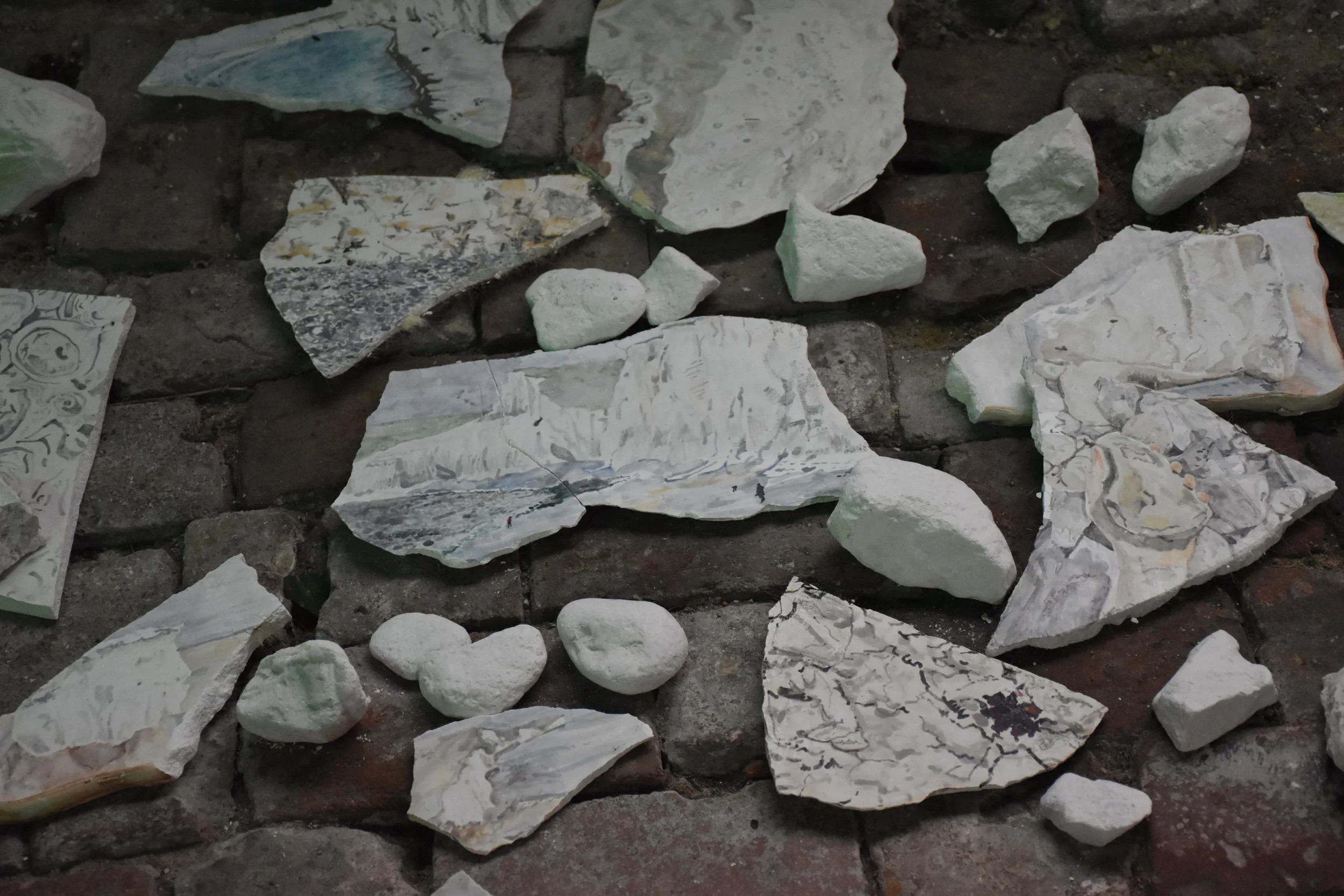   Chalk  video projection, mirror and shelf, cheese, chalk and paintings on plaster 