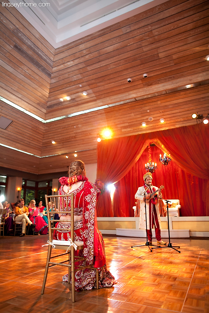  grooms sings song to bride in ballroom celebration 
