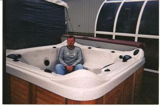   Josh at the County Fair showing how comfortable a Spa is  