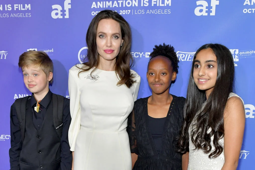 Angelina Jolie with two of her children and Saara Chaudry, the voice of Parvana ( extreme right) CREDIT: Getty