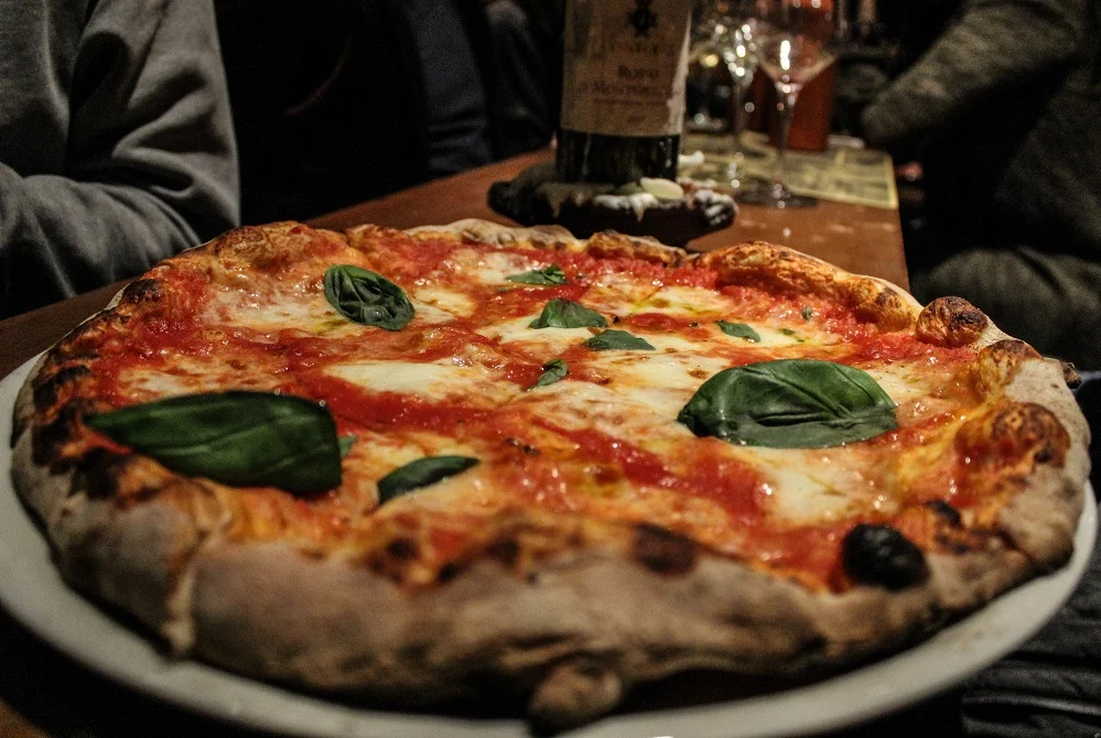 pic of simple pizza and wine bottle.jpg