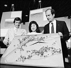 Jan Scruggs, Maya Lin, and Bob Doubek with a model of Lin’s design for the Vietnam Veterans MemorialDoubek, Scruggs, and Wheeler stood together against the opposition. After the compromise of adding a statue and a flagpole to the site, groundbreakin…