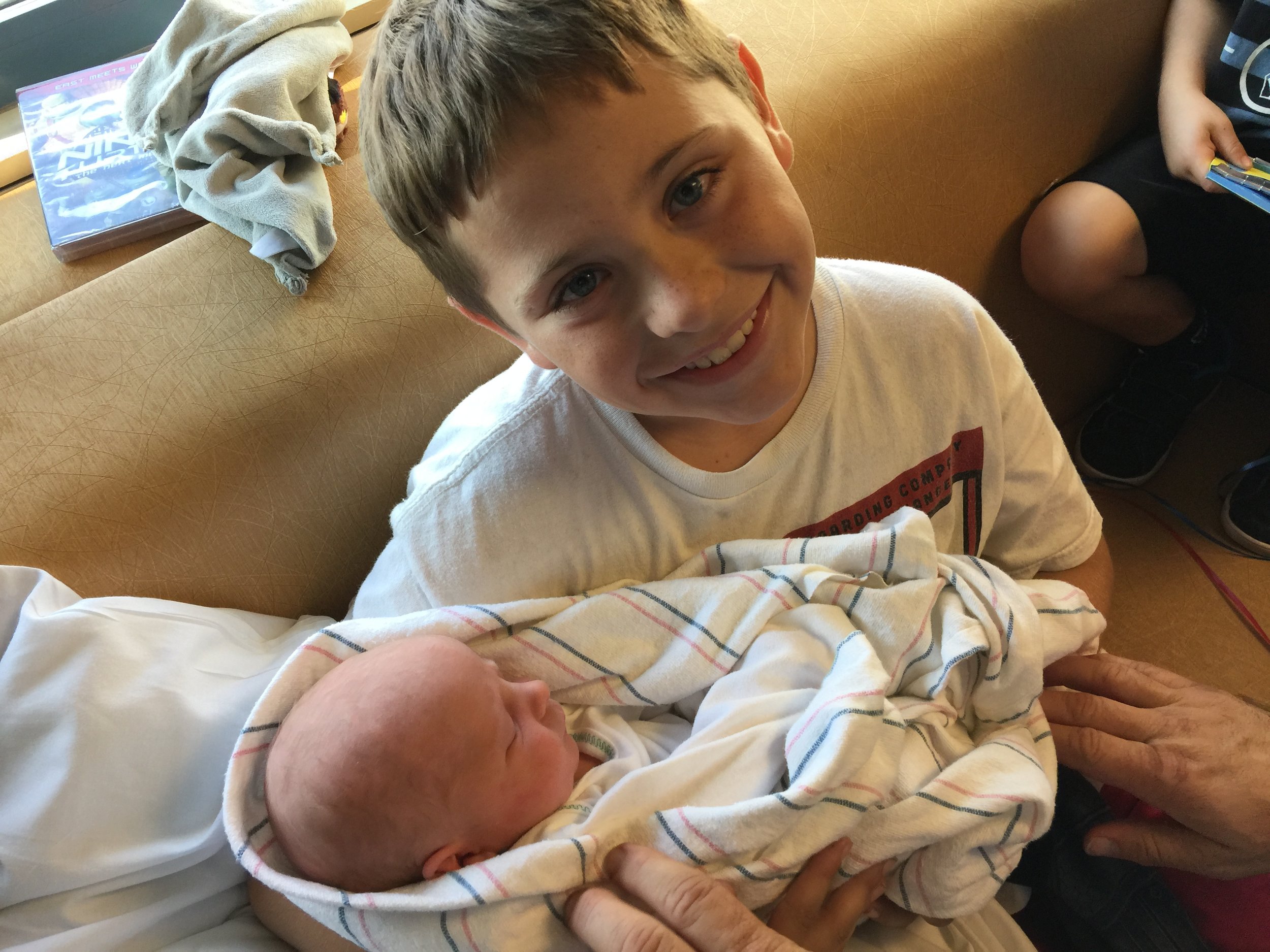 First time meeting baby brother! Oliver cried tears of joy when he first saw him--seriously adorable!!